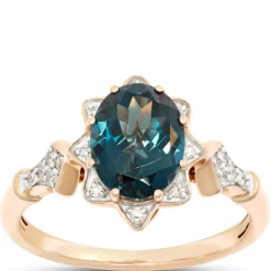 Oval Blue Topaz and Diamond Ring, 1/10 Total Carat Weight, 14K Rose Gold