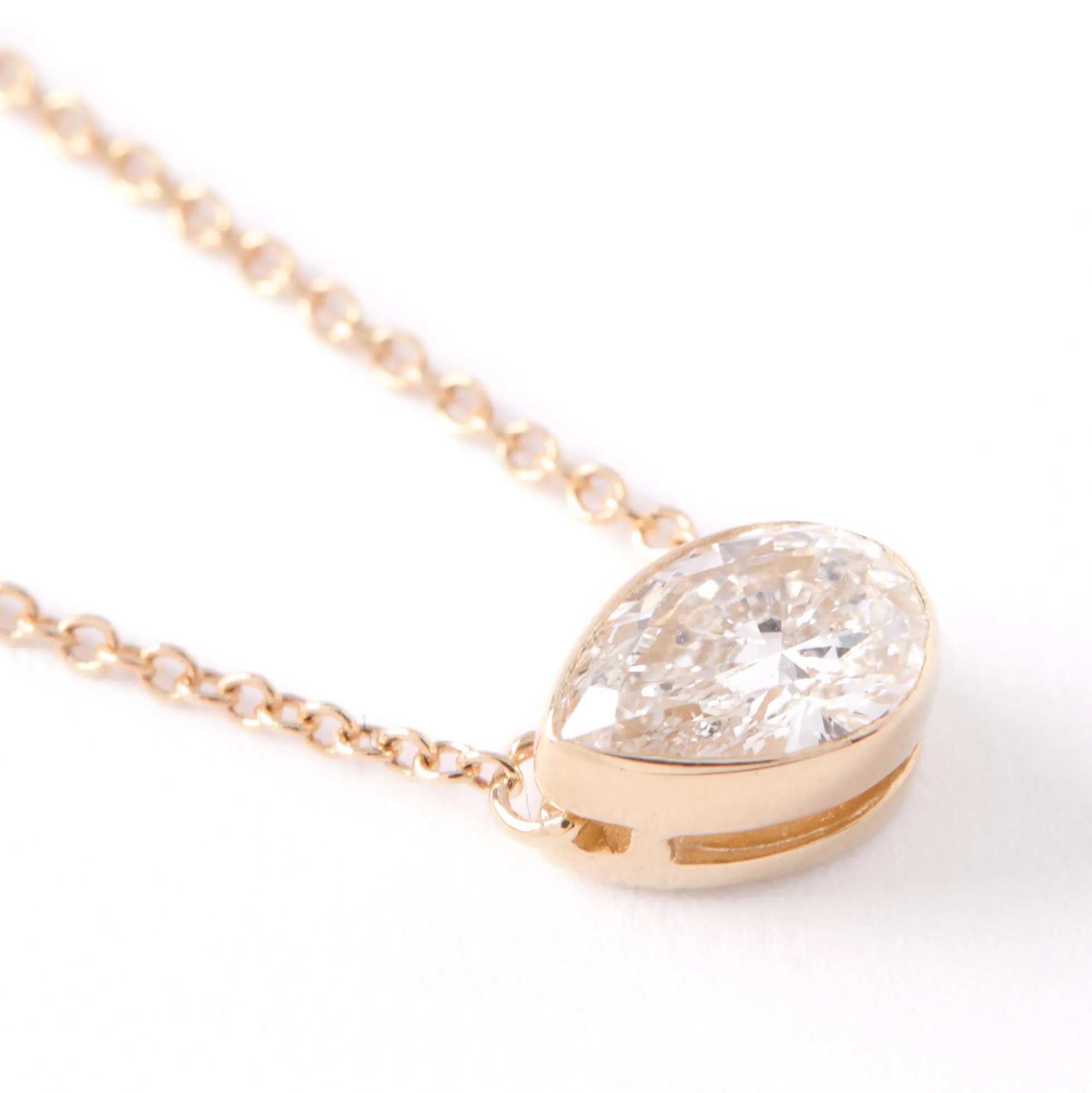 Pear Diamond Invisible Bezel Pendant, ½ Carat Total Weight, 14K Yellow Gold