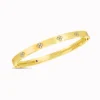 Roberto Coin 18K Gold Love in Verona Narrow Width Diamond Accent Bangle